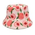 Detailed close-up of reversible bucket hat featuring peach print on light pink fabric - M (56-58cm) / Peach Pink