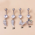 Detailed view of four stainless steel belly rings with zircon leaf wing butterfly pendants - Leaf Style (1#)