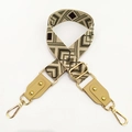 Detail of jacquard woven strap with geometric rhombus pattern and gold metal hardware - No.4 Green Coffee Jacquard + Khaki Leather