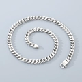 Detailed view of silver 8mm stainless steel Cuban link chain with a polished finish - Sleek Clasp / 45cm