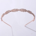 Dettaglio di cerchietto in metallo oro rosa con foglie di strass per acconciature - Oro rosa