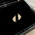 Detail view of gold leaf earrings with green and white zircons on black velvet case - 35# Silver Needle-Golden Leaf Zirconia