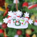 Resin snowman family of five Christmas ornament with green wreath and colorful hats - 5 People Snowman Family