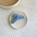 Blue plush hair claw clip made of soft faux fur on a ceramic plate, elegant hair accessory - Sky Blue