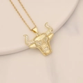 Close-up of golden bull head pendant with micro-pave cubic zirconia on beige tray - 3D Face Zircon Inlaid Bull Style (24#)