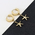 Close-up of golden starfish hoop earrings featuring polished metallic texture on dual background - Small Starfish - Gold