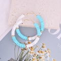 Bohemian sky blue and white polymer clay hoop earrings with golden spacers and buckles - Lake Blue