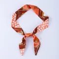 Orange silk scarf with brown chain texture and white polka dots for handbag styling - X18-Multi