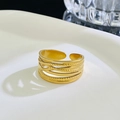 Adjustable gold plated stainless steel ring with multi-layer textured and smooth crossover bands - 14 Gold DZ-934