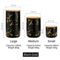 Set of black and gold marble ceramic storage jars with bamboo lids in three sizes - Small / Black & Gold