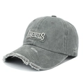 Gros plan sur le logo ANGELS brodé en 3D et la visière usée d'une casquette grise - Réglable / Gris