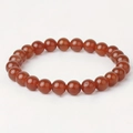 Classic beaded bracelet featuring polished natural red agate stones on elastic cord - Natural Red Agate / 6mm