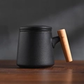 Matte black ceramic tea mug with ergonomic wooden handle and matching lid set - Black