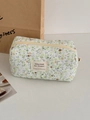 Dettaglio della trousse in velluto a coste verde con trapuntatura a rombi e cerniera - Borsa portaoggetti ottagonale / Fiori Verdi