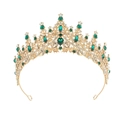 Detail shot of golden baroque crown with emerald crystals and sparkling rhinestones - Gold with Emerald Green Stones