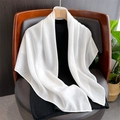 Detailed texture of white linen scarf draped on chair for elegant daily wear - White