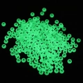 Luminous round flat beads with black X symbol glowing green in the dark for DIY crafts - Letter X / Luminous Green