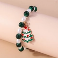 Detail of Christmas beaded bracelet with green beads and a decorative holiday tree charm - Green/White Beads-Enamel Xmas Tree