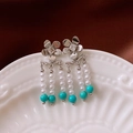 Macro view of vintage silver flower earrings with tassels and turquoise beads on ceramic - 13# Silver Earring Post - Silver Flower - Pearl Tassel