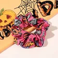 Close-up of pink satin Halloween scrunchie with pumpkin and cat prints on orange cloth - No. 9 Large Scrunchie / Large Size