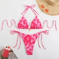 Close-up of pink tropical floral bikini with a gold pendant and adjustable side ties - S / Rose Red
