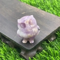 Miniature owl figurine carved from translucent purple amethyst quartz on wood base - Phosphosiderite
