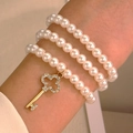 Three-layer pearl bracelet set with a sparkling gold clover key pendant for women - Three Layer Pearl Key Pendant (8273)