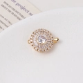 Macro view of 14K gold-plated flower clasp with micro-set cubic zirconia and pearls - Round / Single Row / White