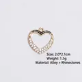 Detail of heart alloy pendant with black enamel trim and inset sparkling rhinestones - Style 10 Heart / Gold