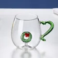 Detail of creative glass mug with green heart handle and 3D Christmas wreath inside - Flower Garland