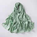 Close-up of green chiffon silk scarf showing smooth soft texture and elegant folds - Light Green