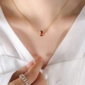 Gold necklace with rectangular red gemstone pendant and matching diamond ring set - Red/January