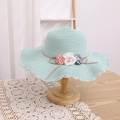 Detail of mint green woven straw hat featuring 3D fabric flowers and pearl accents - 52cm (Recommended 1-4 Years) / Blue Hat