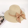 Beige straw beach hat with brown satin ribbon, large bow, and white pearl embellishments - One Size / Apricot