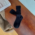 Classic black cotton slouch socks with ribbed texture and elegant ruffled cuff detailing - One Size / Black
