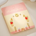 7-piece gold titanium steel earring set featuring hearts, bows, and pearls - Gold Heart Butterfly (E1893-1)