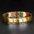 Close-up detail of golden magnetic bracelet with black white and red inset stones - Gold Bracelet