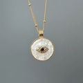 Golden necklace with a shell mother-of-pearl evil eye pendant and sparkling blue zircon - White