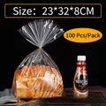 Clear bread bags with gold twist ties and 23x32x8cm dimensions for toast packaging - 23x32+8cm (100 Pieces/Pack) / Clear
