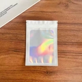 Single holographic resealable bag with white border and iridescent window on wood background - 10.5*15cm White
