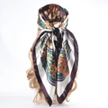 Deep brown satin headscarf with vintage chain and rope prints shown tied on a model - Recommended Color