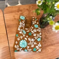 Caramel knit tote bag with vintage floral pattern on a natural wooden tabletop - Hydrangea Khaki