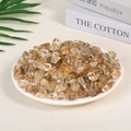 Polished natural rutilated quartz crystal stones displayed in a white ceramic dish - Red Rutilated Quartz (9-12mm) 100g