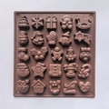 Detailed view of brown 25-cavity silicone mold featuring festive Christmas themed shapes - Coffee