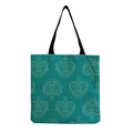 Detailed view of teal canvas tote bag with repeat heart and eye pattern textures - Teal Heart Eye (hm2711)
