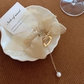 Elegant champagne gold organza ribbon hair claw clip with pearl tassel in lifestyle setting - Mesh Bow with Pearl Pendant / Champagne Lace