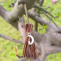 Mini witch broom charm with silver moon and star pendant hanging on a natural tree branch - Branch Broom + Star & Moon