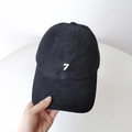 Black washed cotton baseball cap featuring white number 7 embroidery on the front - Black