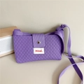 Detail shot of purple knitted crossbody bag with diamond texture and Hilldi logo tag - Purple