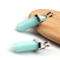 Light blue hexagonal crystal column pendants with silver metal clasps on wood - Luminous Blue